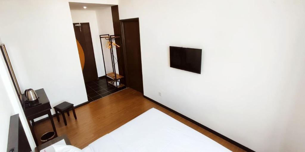 TV a/nebo společenská místnost v ubytování ABA Hotel Kuching Sarawak