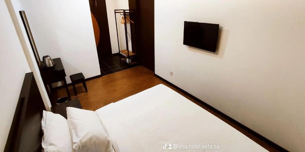 Postel nebo postele na pokoji v ubytování ABA Hotel Kuching Sarawak