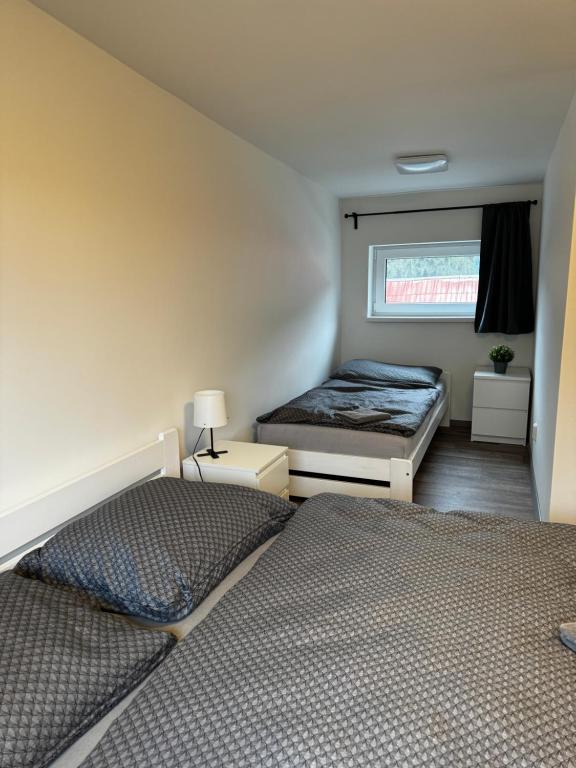 Postel nebo postele na pokoji v ubytování Apartmán 2 Jägerhaus
