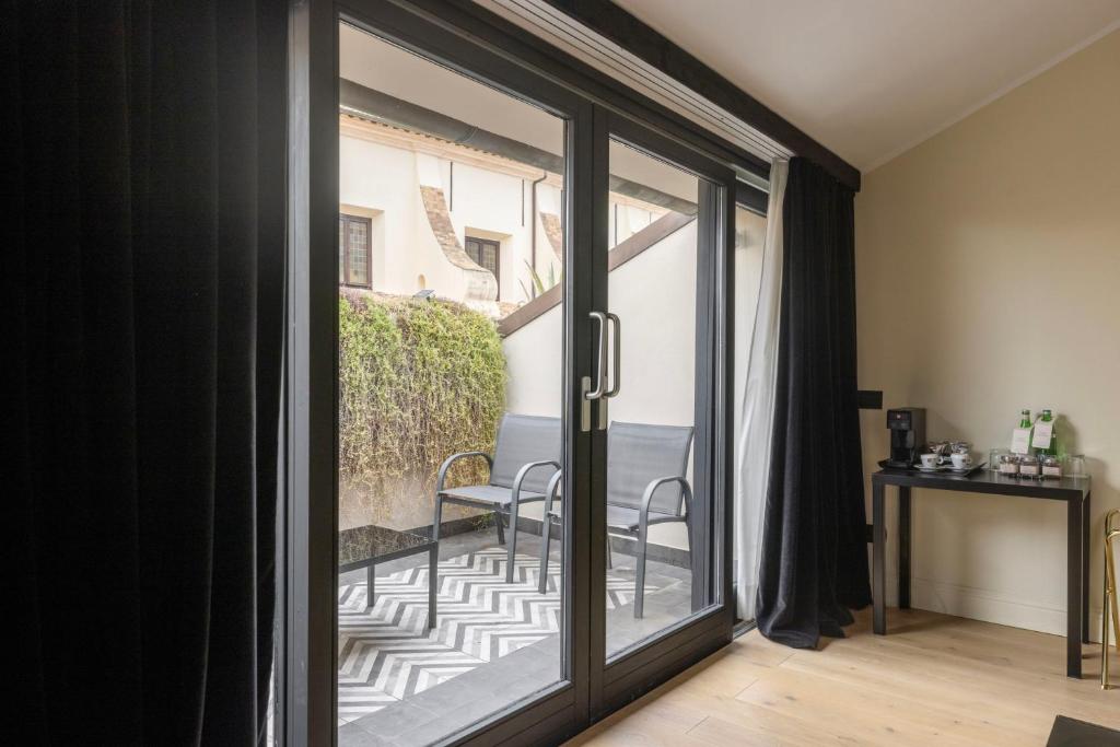 a sliding glass door leading to a balcony at Roma Luxus Hotel in Rome