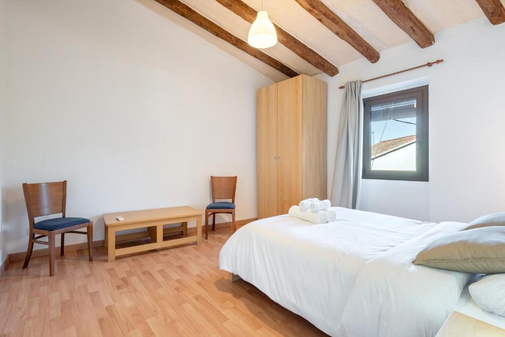 Postel nebo postele na pokoji v ubytování Hauzify I Casa Rourell