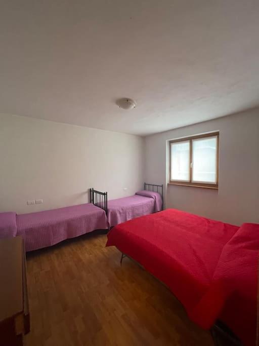 Postel nebo postele na pokoji v ubytování Il nido delle cime