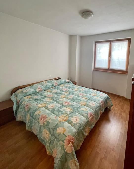 Postel nebo postele na pokoji v ubytování Il nido delle cime