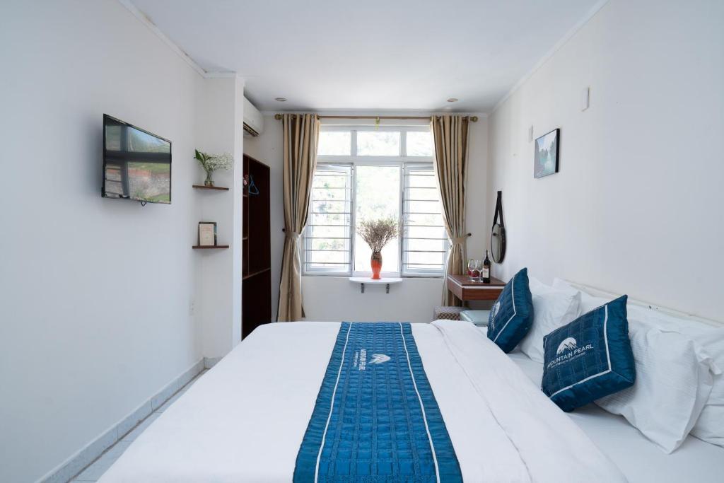 Postel nebo postele na pokoji v ubytování mountainperl hotel 2