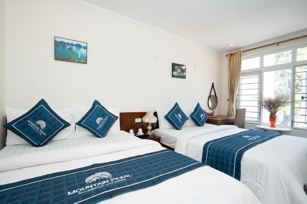 Postel nebo postele na pokoji v ubytování mountainperl hotel 2