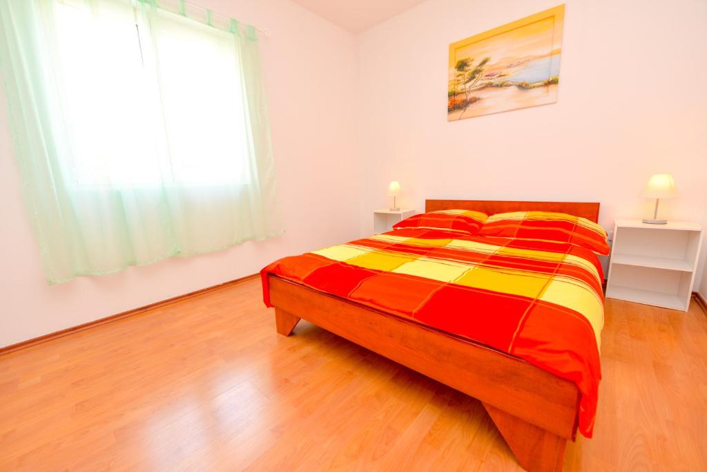Łóżko lub łóżka w pokoju w obiekcie Apartment Dadi