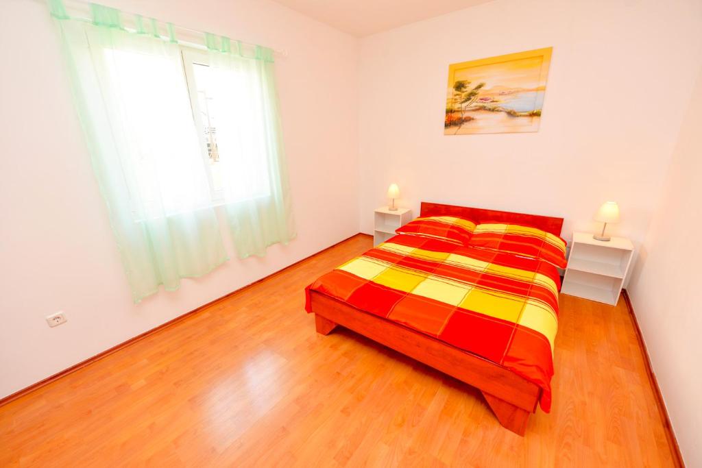 Łóżko lub łóżka w pokoju w obiekcie Apartment Dadi