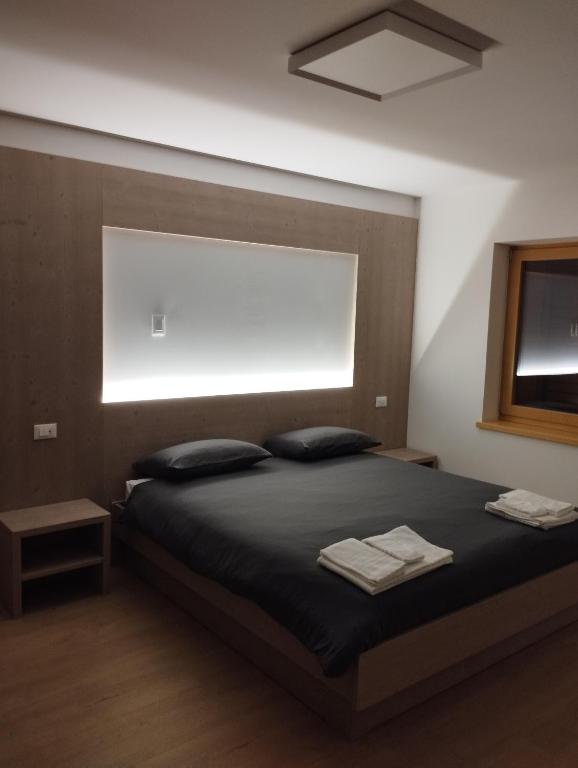 Postel nebo postele na pokoji v ubytování Ristorante e B&B IN SELLA