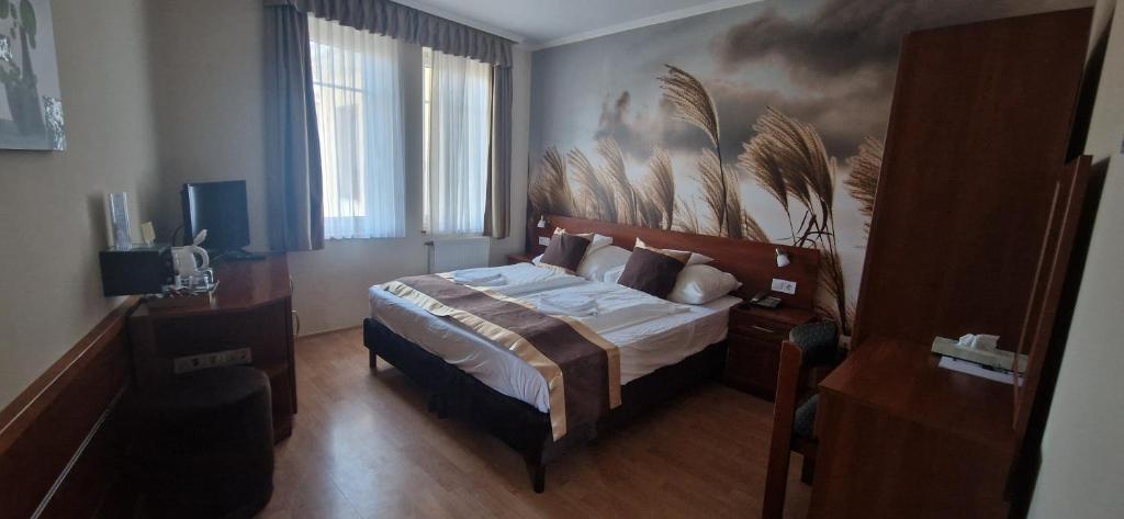 Postel nebo postele na pokoji v ubytování Hotel Patonai