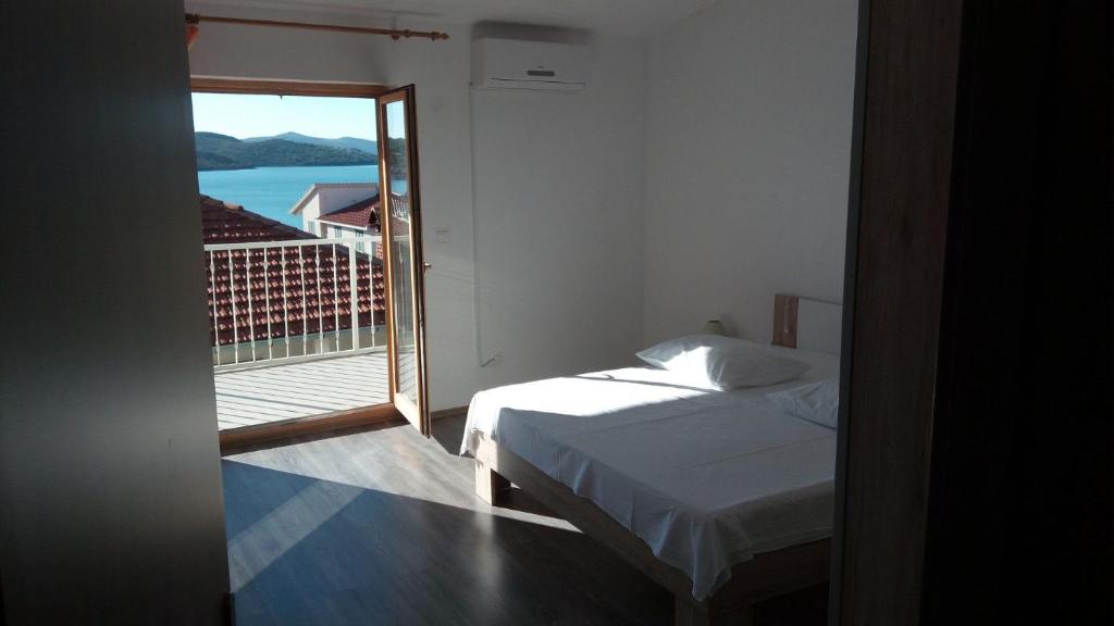 Posteľ alebo postele v izbe v ubytovaní Apartment Marijica