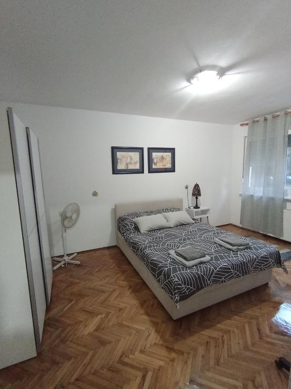 Postel nebo postele na pokoji v ubytování Carpe Diem Vrbas