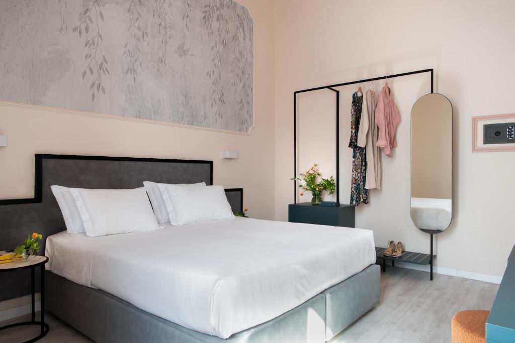 Postel nebo postele na pokoji v ubytování Hotel Fiorita