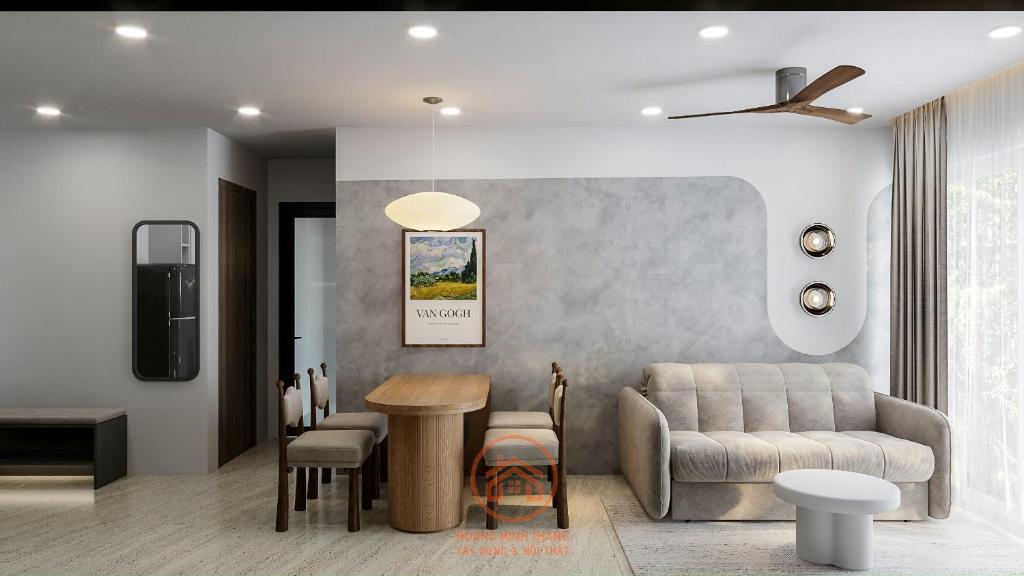 a living room with a couch and a table at Nera home, An apartment Huế in Thôn Văn Dương