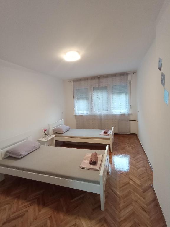 Postel nebo postele na pokoji v ubytování Carpe Diem Vrbas