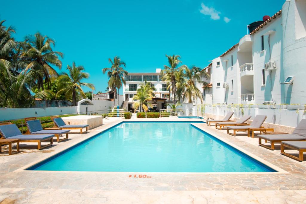 Bazén v ubytování Hotel Caribe Coveñas nebo v jeho okolí