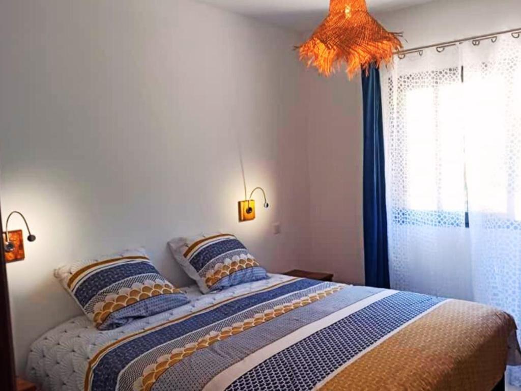 Postel nebo postele na pokoji v ubytování Villa Les Jardins de la Trinité