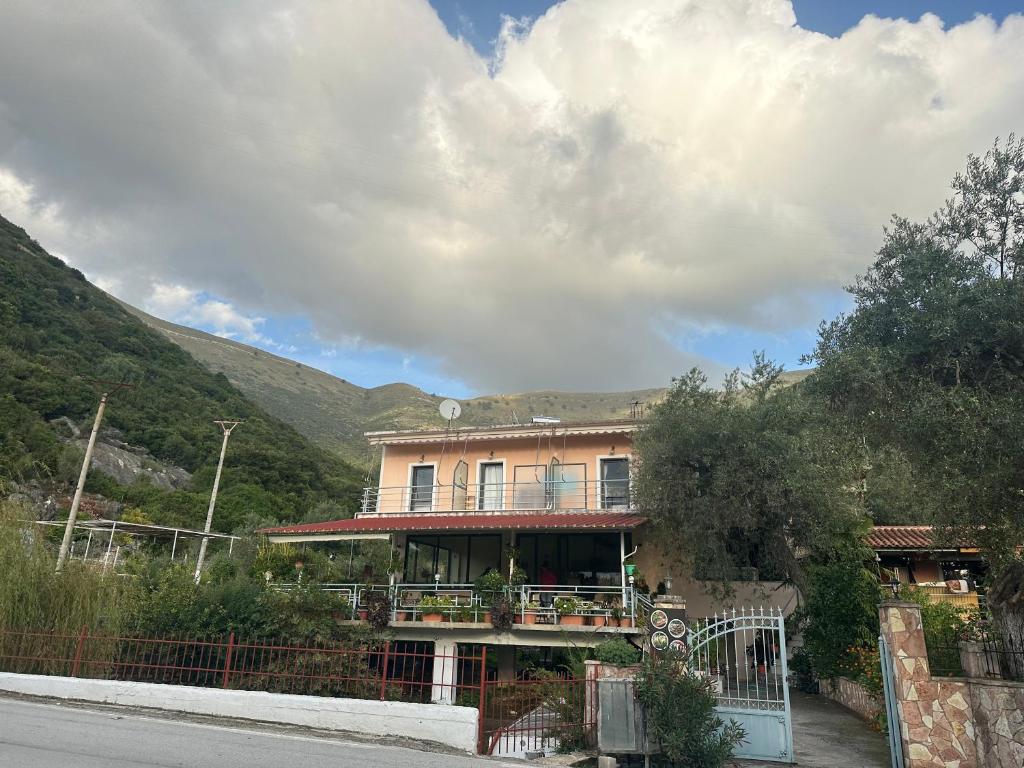 a house on the side of a road at Moliana Bunec in Himare