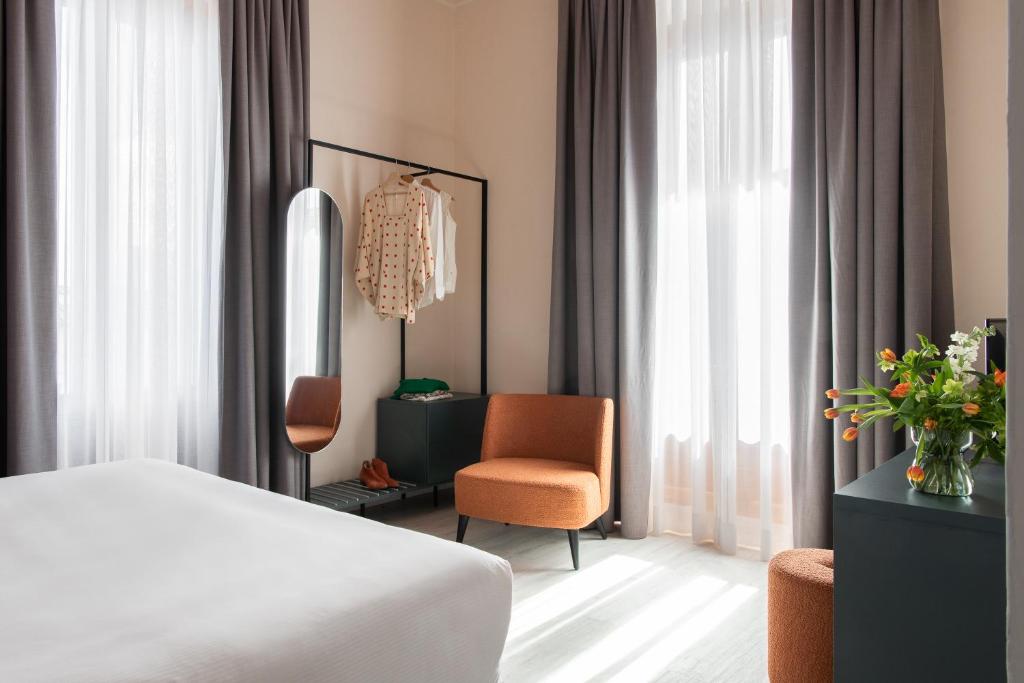 Postel nebo postele na pokoji v ubytování Hotel Fiorita