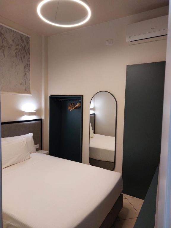 Postel nebo postele na pokoji v ubytování Hotel Fiorita