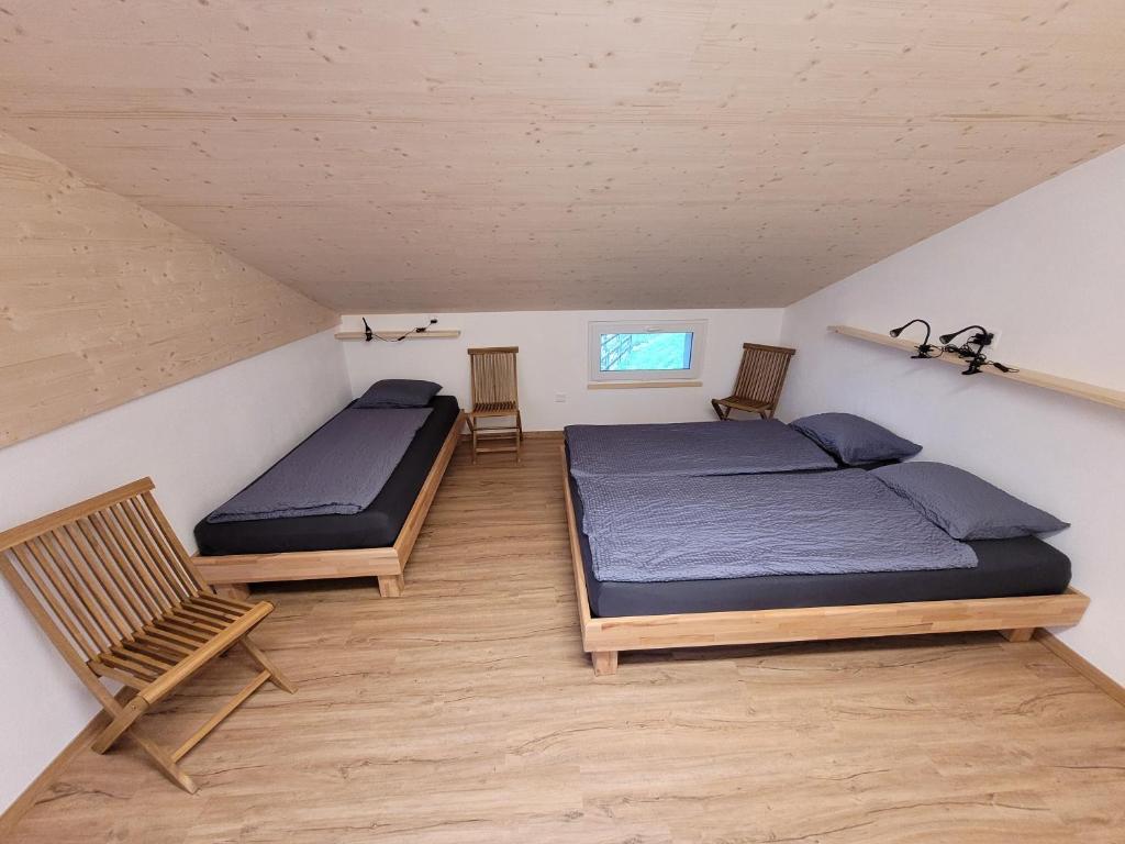 Postel nebo postele na pokoji v ubytování Ostello Pro Osco