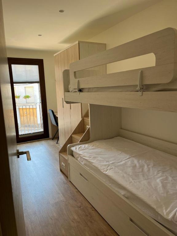 Postel nebo postele na pokoji v ubytování Apartament MOIXERA de Molló Parc