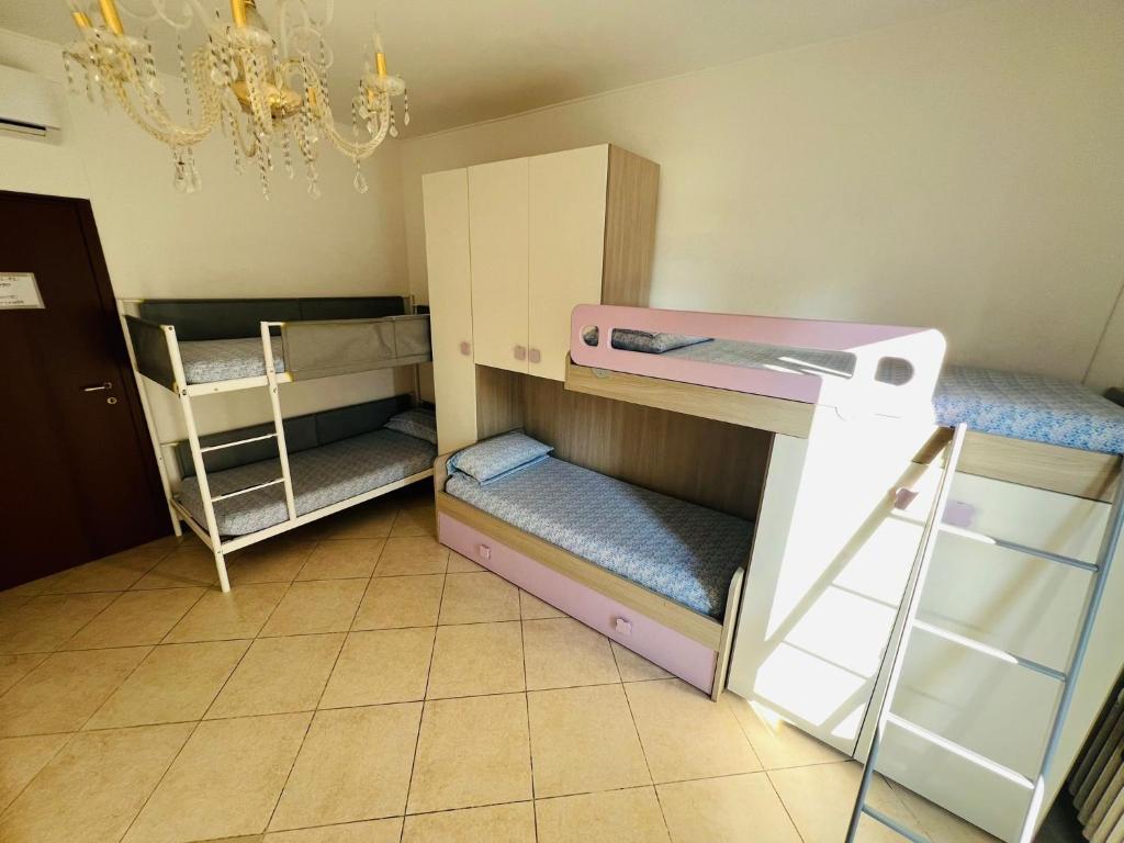 Postel nebo postele na pokoji v ubytování Gigli, rooms con cucina in comune e terrazza