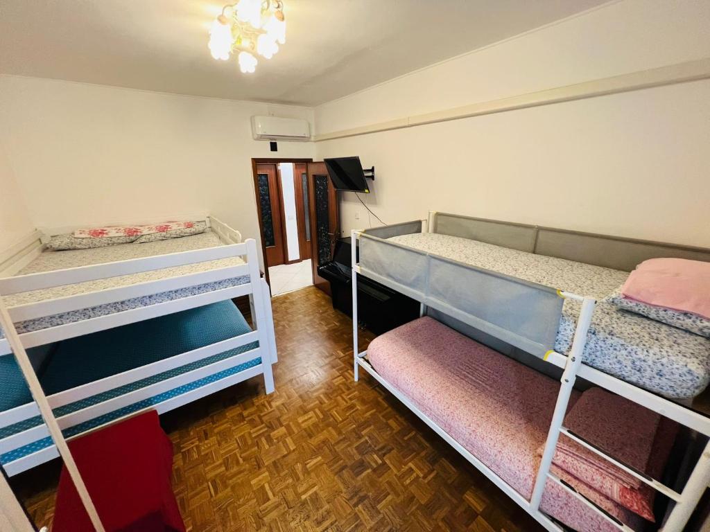 Postel nebo postele na pokoji v ubytování Gigli, rooms con cucina in comune e terrazza