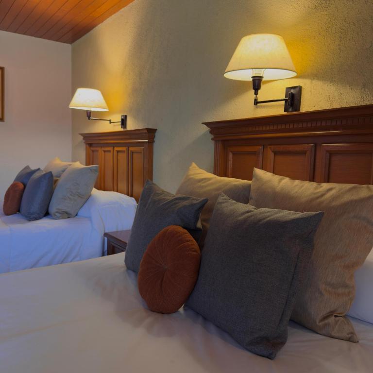 Postel nebo postele na pokoji v ubytování Hotel El Paraiso
