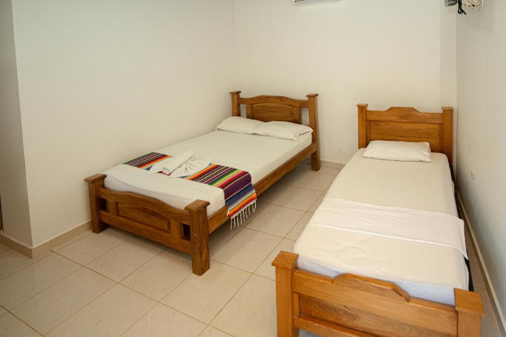 Postel nebo postele na pokoji v ubytování Hotel Caribe Coveñas