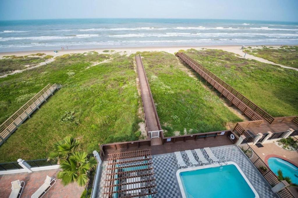 an aerial view of a beach with a swimming pool at 5 BEDROOM BEACHFRONT CONDO - 4th Floor in South Padre Island