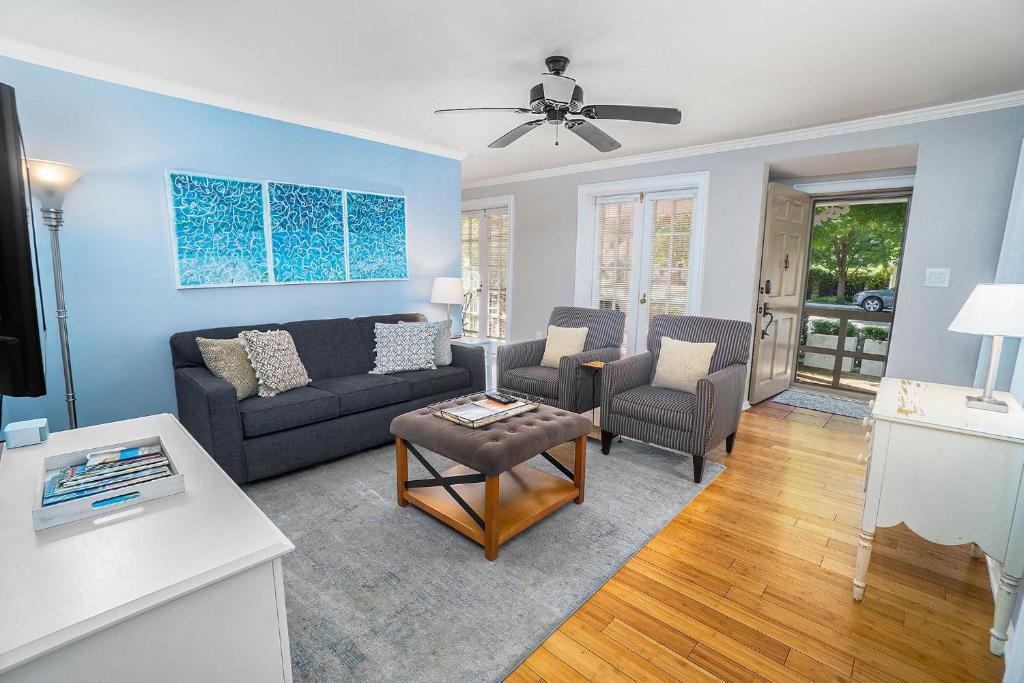 a living room with a couch and chairs at Butlers Quarters in Saugatuck
