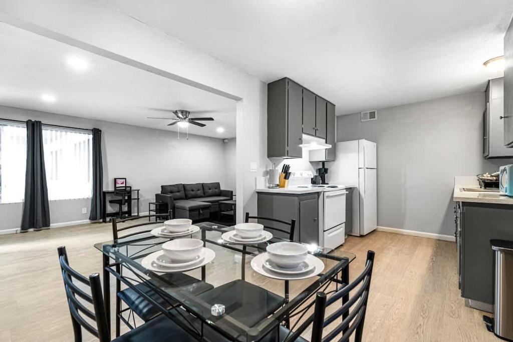 a kitchen and living room with a table and chairs at Charming Two Bedroom Sleeps 6! Close To Strip! in Las Vegas