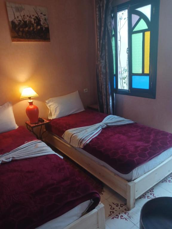 Postel nebo postele na pokoji v ubytování Riad Dantella