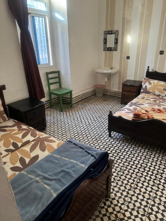 Postel nebo postele na pokoji v ubytování Hotel majestc