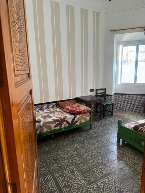 Postel nebo postele na pokoji v ubytování Hotel majestc