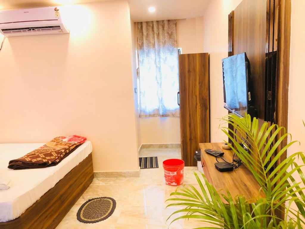 TV a/nebo společenská místnost v ubytování Tropicana Beach Resort, Mandarmani