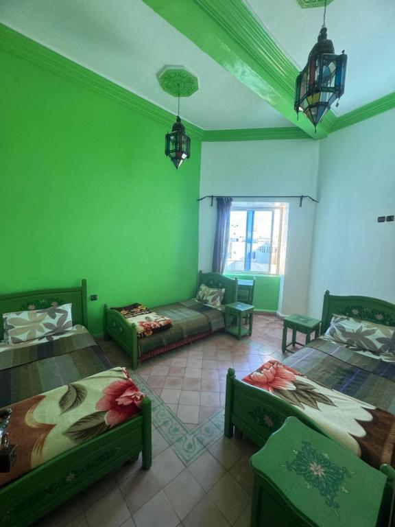 Postel nebo postele na pokoji v ubytování Hotel majestc
