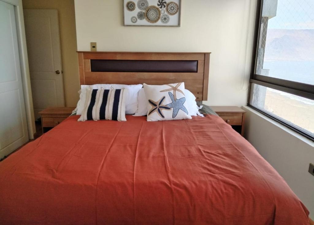 Ένα ή περισσότερα κρεβάτια σε δωμάτιο στο Departamento frente a playa brava