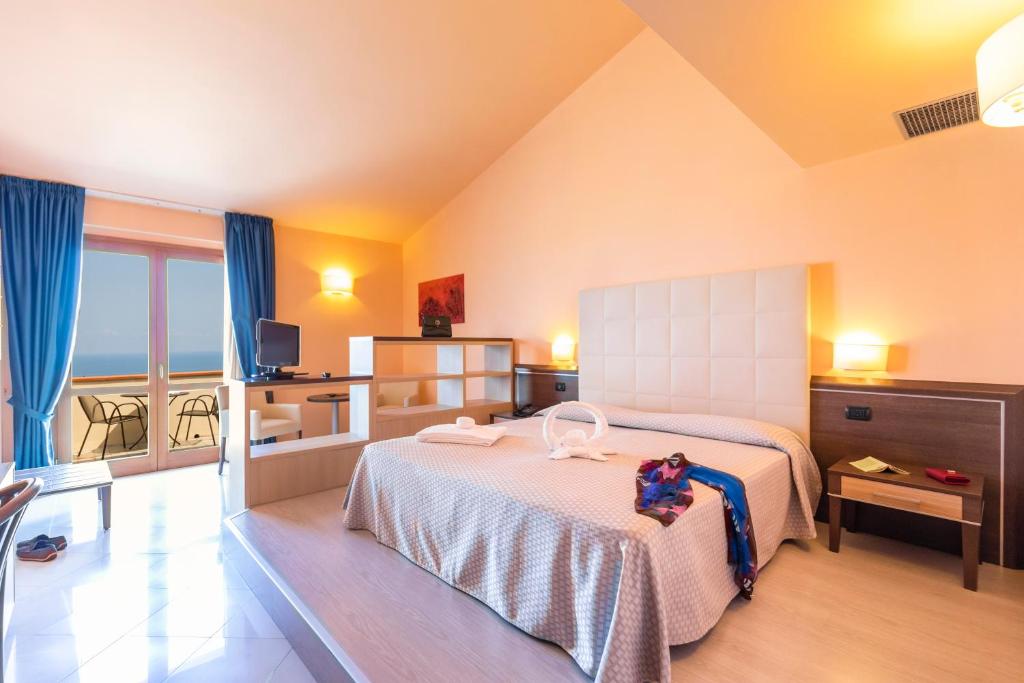 Postel nebo postele na pokoji v ubytování Hotel Tropis