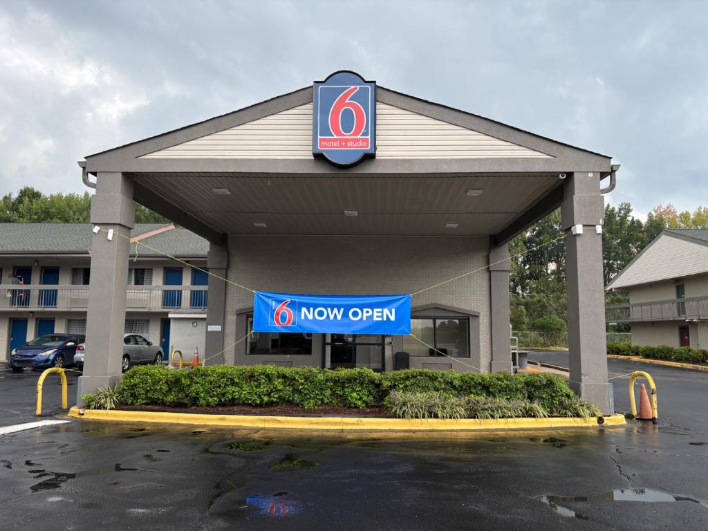 a new open sign in front of a new office at Studio 6 Suites Charlotte, NC Northlake in Charlotte