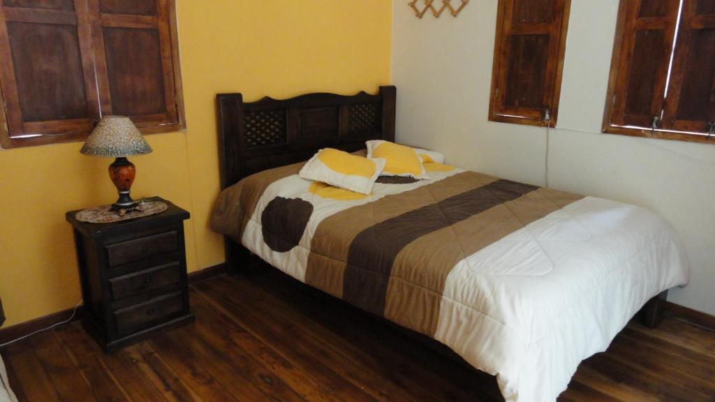 Postel nebo postele na pokoji v ubytování Hostal del Piamonte