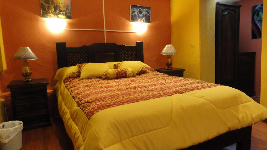 Postel nebo postele na pokoji v ubytování Hostal del Piamonte