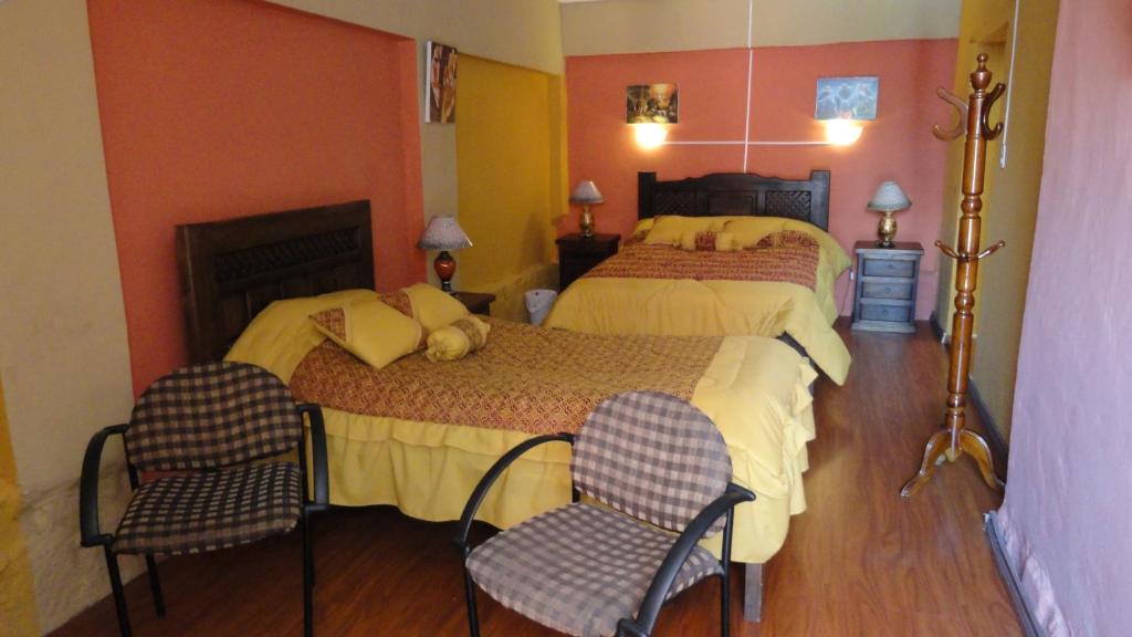 Postel nebo postele na pokoji v ubytování Hostal del Piamonte