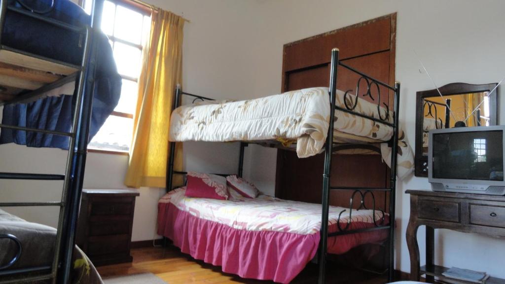 Postel nebo postele na pokoji v ubytování Hostal del Piamonte