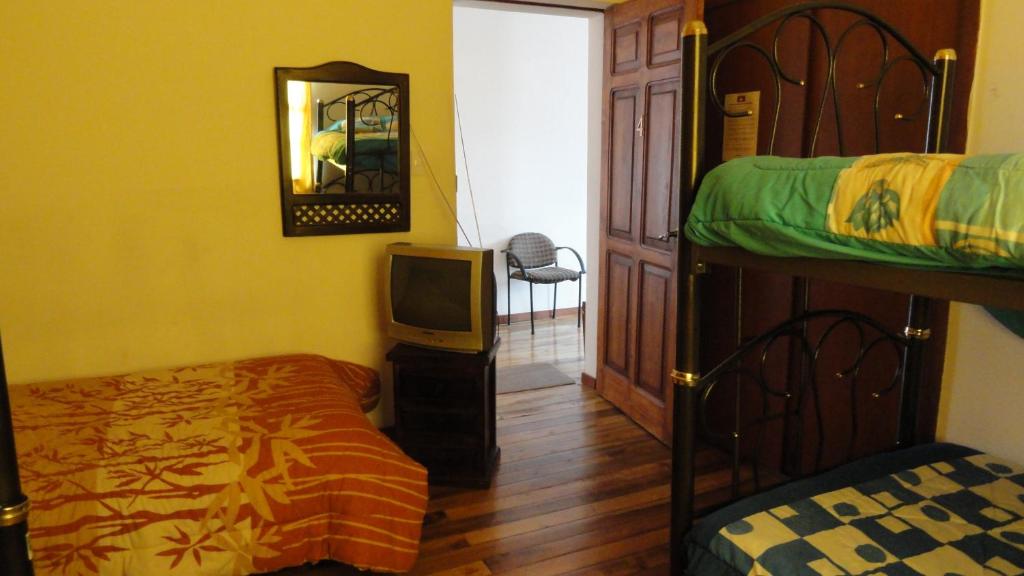 Postel nebo postele na pokoji v ubytování Hostal del Piamonte