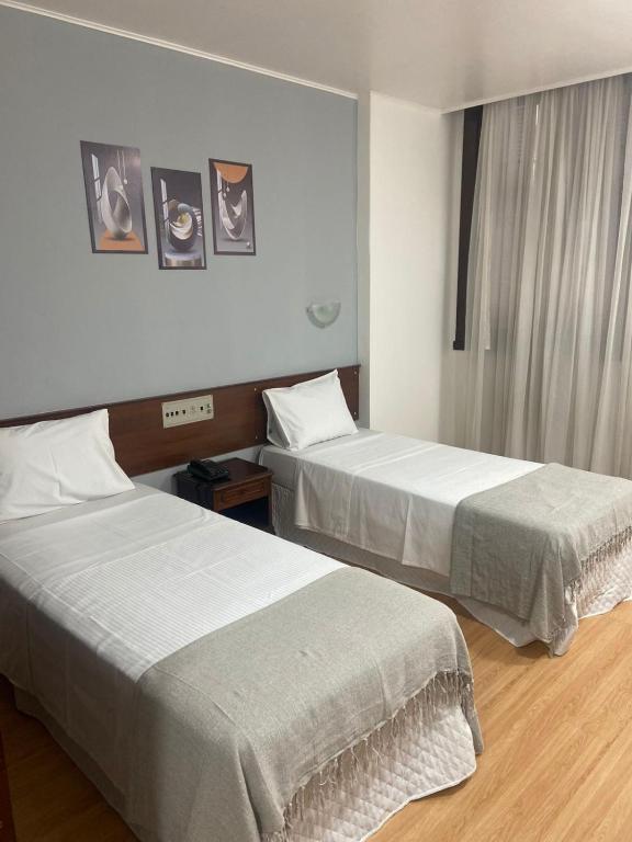 Postel nebo postele na pokoji v ubytování City Hotel by Fast10