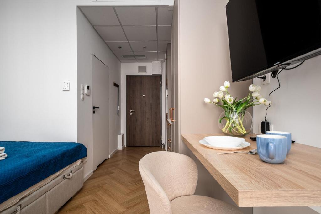 Televízia a/alebo spoločenská miestnosť v ubytovaní Kasprzaka 29 Bliska Wola Tower By Perfect Apart