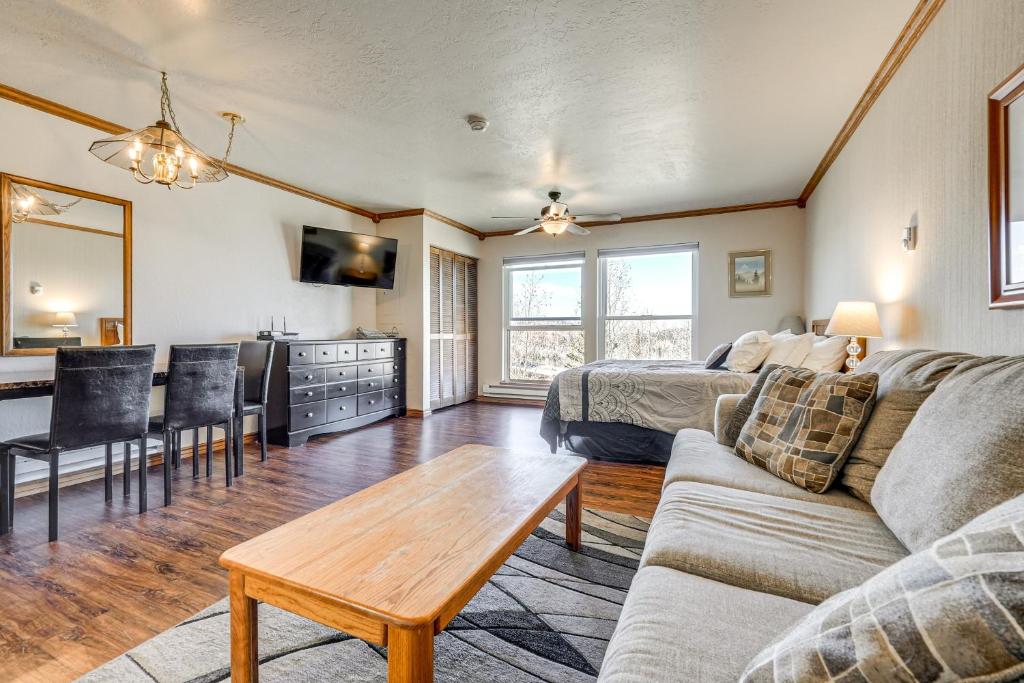 a living room with a couch and a table at Ski-In/Ski-Out Brian Head Studio in Brian Head