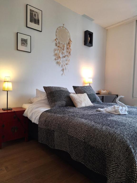 Postel nebo postele na pokoji v ubytování B&B De Lelie
