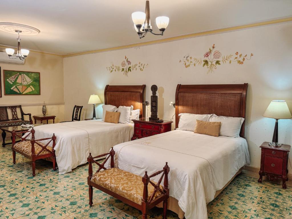 Postel nebo postele na pokoji v ubytování Mansión Mérida Boutique Hotel - Restaurant